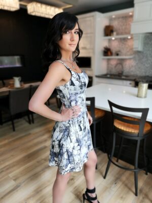 Mini sundress in black, white and sprinkling of purple.