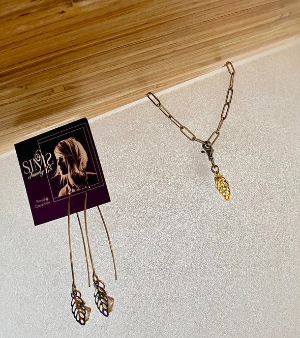 Silver sims earrings with leaf charm.