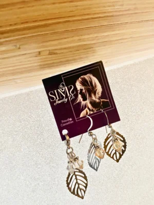 Leaf and crystals pendant with matching earrings.