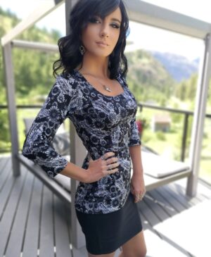 Black round neck fitted top with sunflower print.