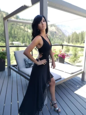 Black backless maxi dress with lace trim.