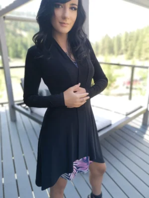 Long-sleeve black cardigan with pointed sides.