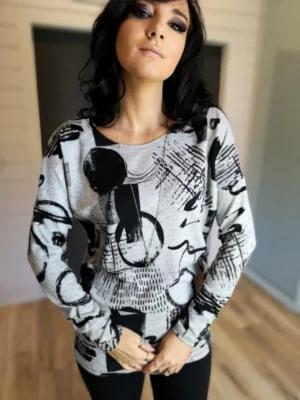 Black and gray print long sleeve slouchy yet fitted in the hips and arms tunic top.