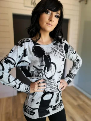 Black and gray print long sleeve slouchy yet fitted in the hips and arms tunic top.