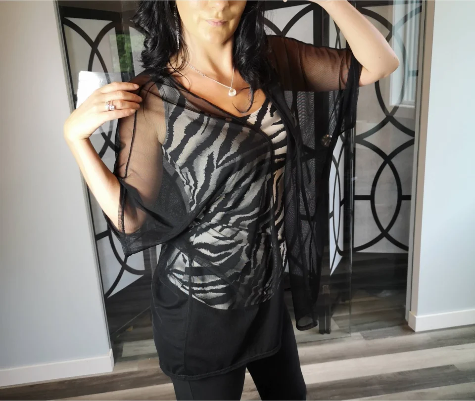 Black mesh cover up light jacket.