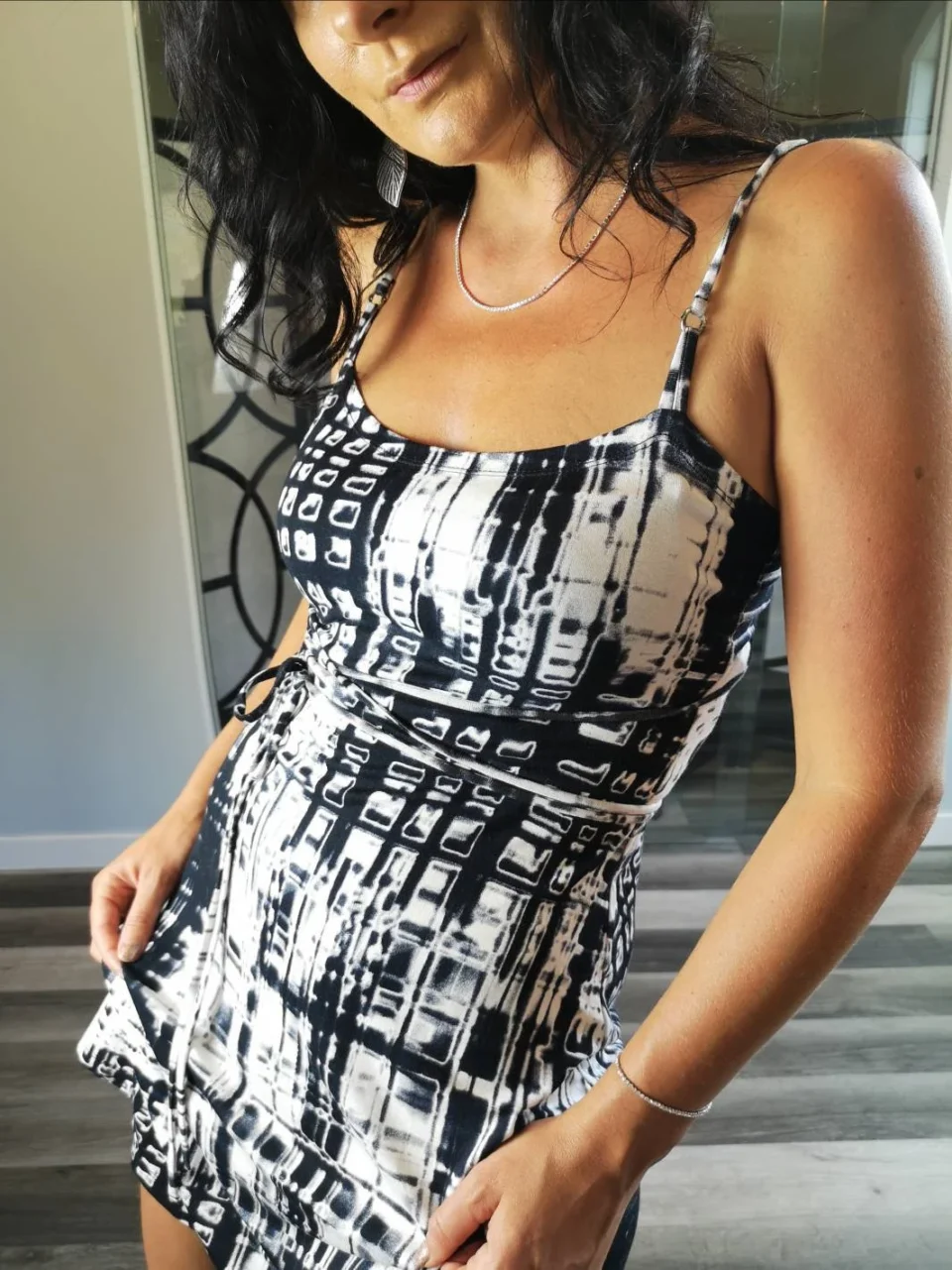 Cute little summer dress in neutral black and white abstract stripey print.