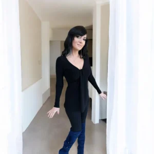 Black long sleeve top with a draping feature in the bust.