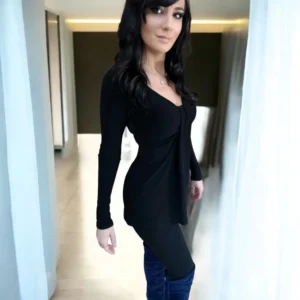 Black long sleeve top with a draping feature in the bust.