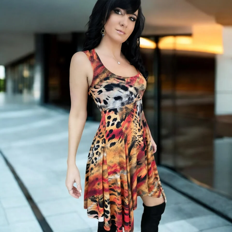 Sleeveless orange, black and yellow animal print tissue hem round neck mini dress.