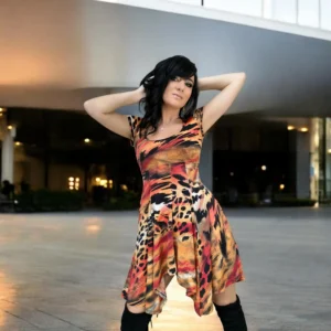 Cap sleeve orange, black and yellow animal print tissue hem round neck mini dress.
