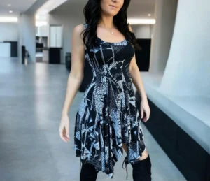 Gray on black newspaper print sleeveless non-symmetrical short dress.