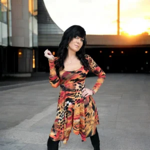 Long-sleeve orange, black and yellow animal print tissue hem round neck mini dress.