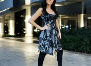 Gray on black newspaper print sleeveless non-symmetrical short dress.