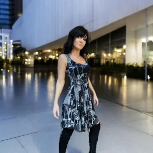Gray on black newspaper print sleeveless non-symmetrical short dress.