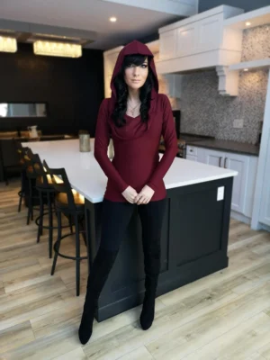 Burgundy red long-sleeve fitted hooded top in soft, sustainable bamboo. Besides being worn up or down, the hood can be draped down your bust to amplify the cowl neck, or worn off the shoulders.