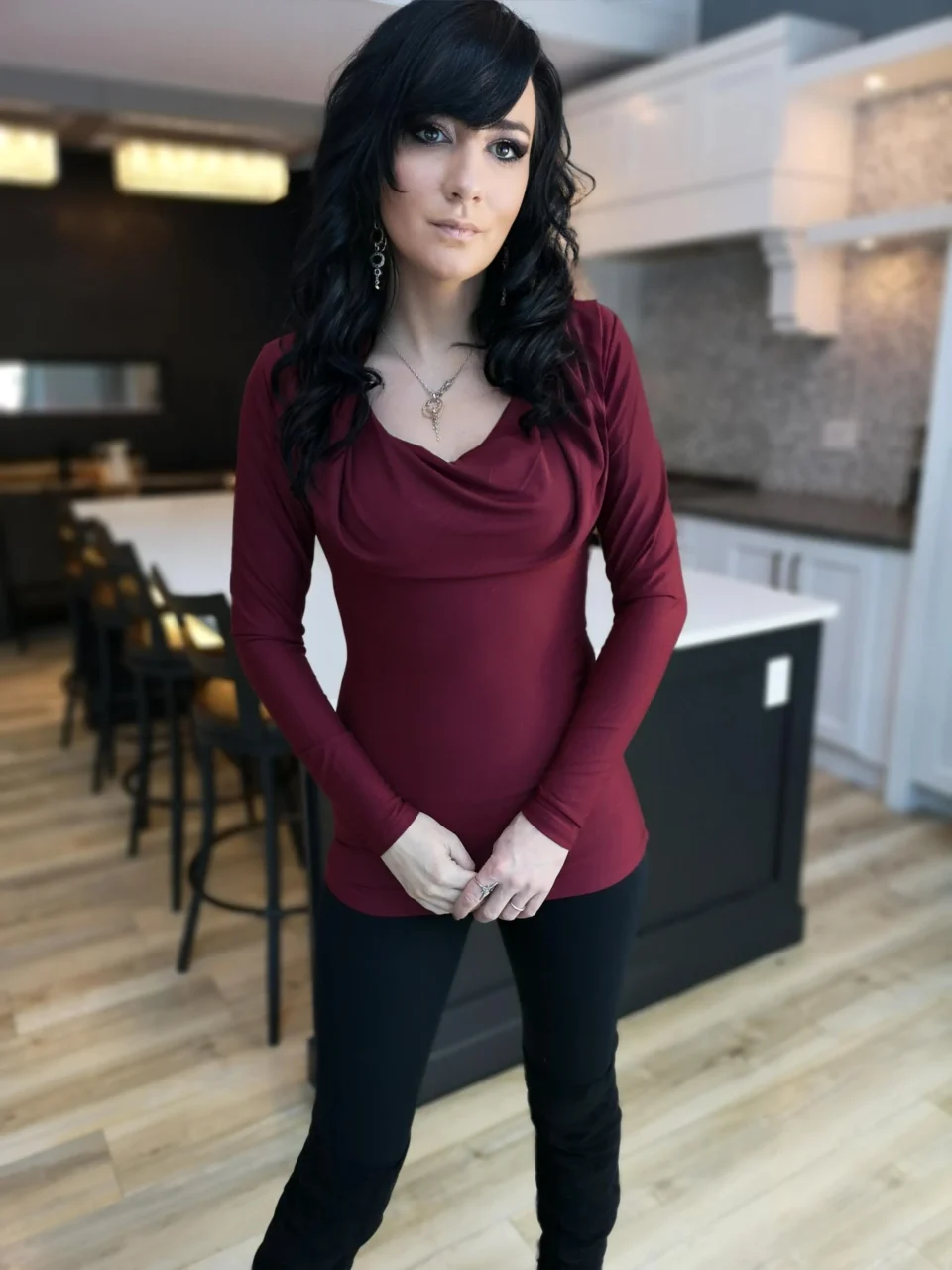 Burgundy red long-sleeve fitted hooded top in soft, sustainable bamboo. Besides being worn up or down, the hood can be draped down your bust to amplify the cowl neck, or worn off the shoulders.