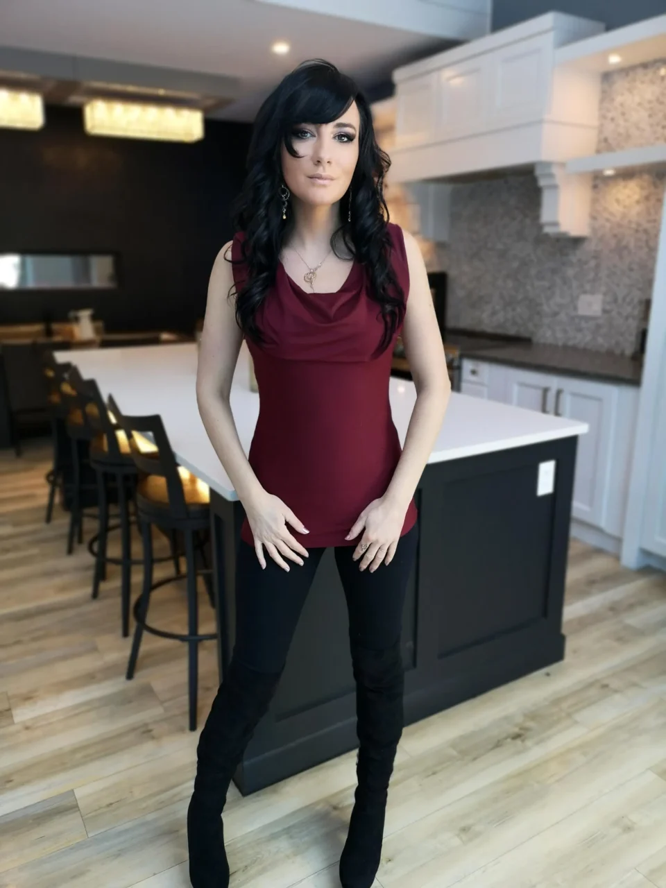 Burgundy red sleeveless fitted hooded top in soft, sustainable bamboo. Besides being worn up or down, the hood can be draped down your bust to amplify the cowl neck, or worn off the shoulders.