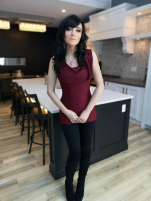 Burgundy red sleeveless fitted hooded top in soft, sustainable bamboo. Besides being worn up or down, the hood can be draped down your bust to amplify the cowl neck, or worn off the shoulders.