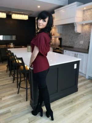 Burgundy red sleeveless fitted hooded top in soft, sustainable bamboo. Besides being worn up or down, the hood can be draped down your bust to amplify the cowl neck, or worn off the shoulders.