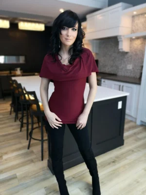 Burgundy red sleeveless fitted hooded top in soft, sustainable bamboo. Besides being worn up or down, the hood can be draped down your bust to amplify the cowl neck, or worn off the shoulders.