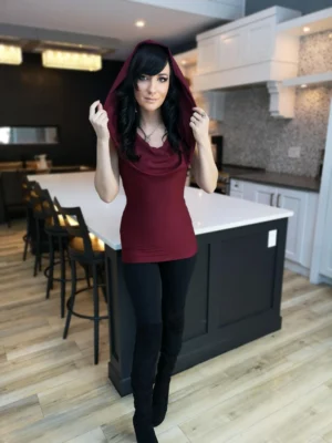 Burgundy red sleeveless fitted hooded top in soft, sustainable bamboo. Besides being worn up or down, the hood can be draped down your bust to amplify the cowl neck, or worn off the shoulders.