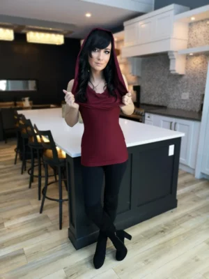Burgundy red sleeveless fitted hooded top in soft, sustainable bamboo. Besides being worn up or down, the hood can be draped down your bust to amplify the cowl neck, or worn off the shoulders.