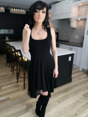 Black sleeveless tissue hem short dress.