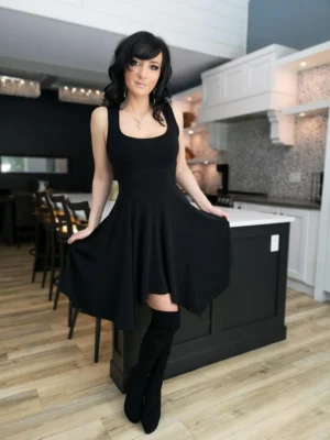 Black sleeveless tissue hem short dress.