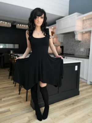 Black sleeveless tissue hem short dress.