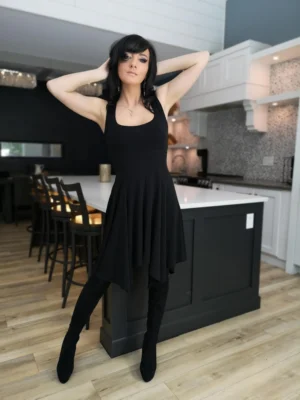 Black sleeveless tissue hem short dress.