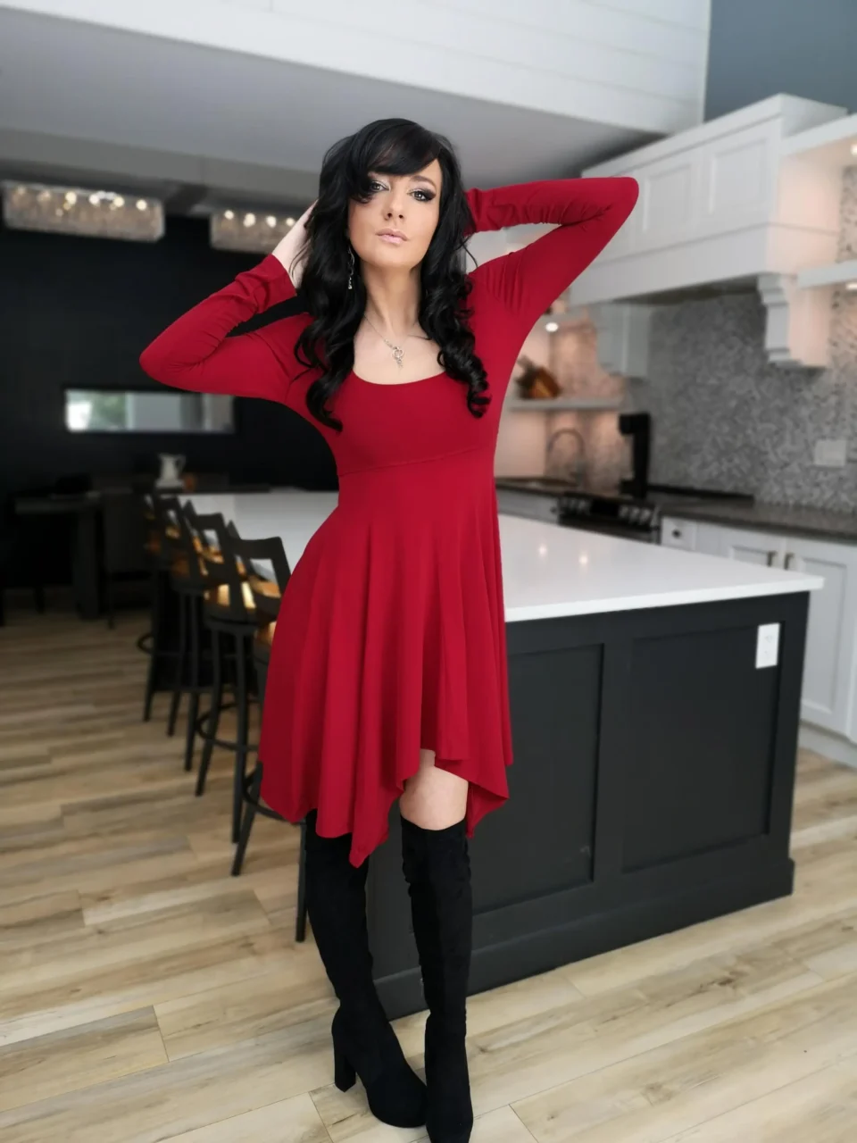 Short red long-sleeve tissue hem dress.