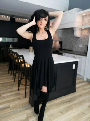 Black sleeveless tissue hem short dress.
