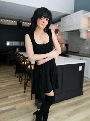 Black sleeveless tissue hem short dress.