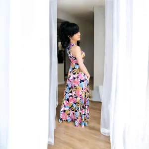 Tropical print pink blue and gold on black fitted bust sleeveless maxi dress.