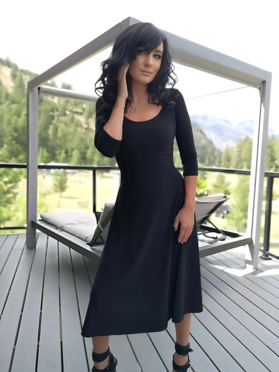 Black 3/4 sleeve mid-length dress.