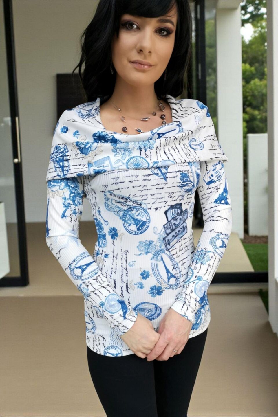 Hooded long-sleeve blue and white print tunic top with a cowl neckline or off th e shoulders look. Silky smooth with a ribbed fabric.