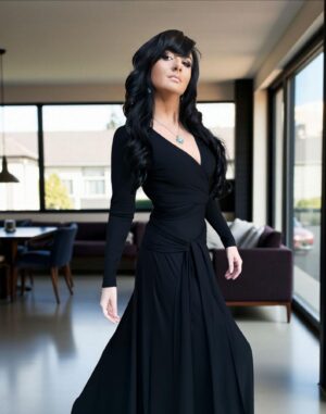 Versatile reversible black long-sleeve fitted maxi dress in bamboo/spandex, with V-neck on one side, boat neckline on the other, and two long panels that can be cinched and tied in various ways.