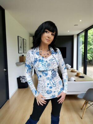Hooded long-sleeve blue and white print tunic top with a cowl neckline or off th e shoulders look. Silky smooth with a ribbed fabric.