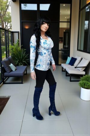 Hooded long-sleeve blue and white print tunic top with a cowl neckline or off th e shoulders look. Silky smooth with a ribbed fabric.