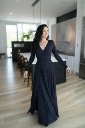 Maxi navy blue long-sleeve infinity fitted wrap dress, reversible with v-neck or boat neck options, and provided with long waist ties.