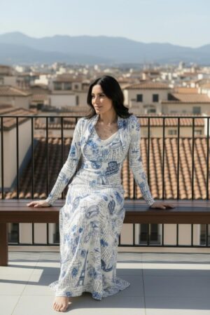 Long-sleeve hooded cowl neck white and blue Paris print maxi dress.