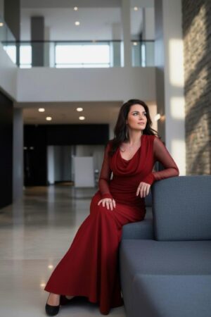 Scarlet red hooded cowl neck maxi dress with mesh sleeves and finger cutouts.