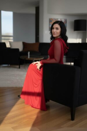 Scarlet red hooded cowl neck maxi dress with mesh sleeves and finger cutouts.