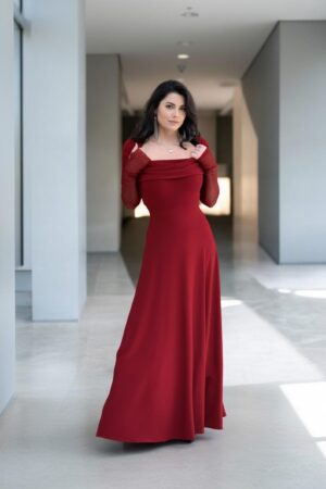Scarlet red hooded cowl neck maxi dress with mesh sleeves and finger cutouts.