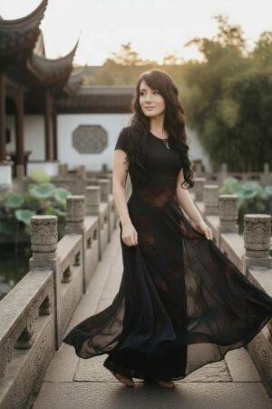 Empire waist cap sleeve maxi dress with mesh overlay and brown velvet floral stencil atop the mesh.