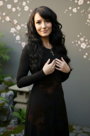 Empire waist, long-sleeve maxi dress with mesh overlay and brown floral velvet stencil atop the mesh.